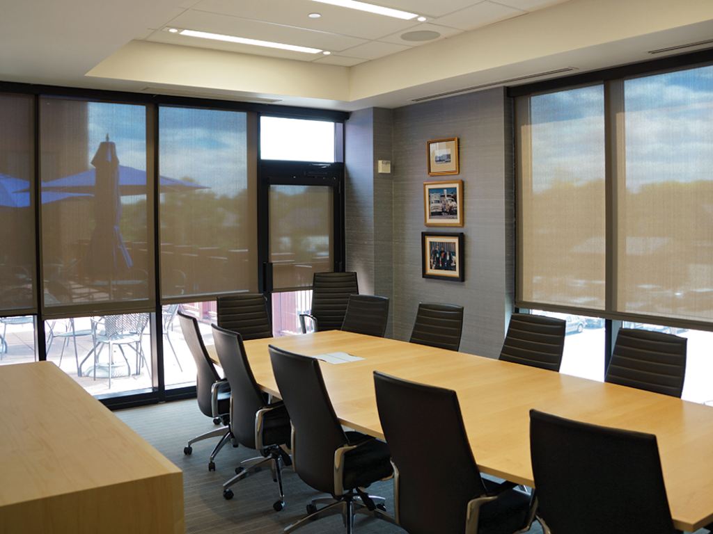 Office conference room with solar shades on the windows.