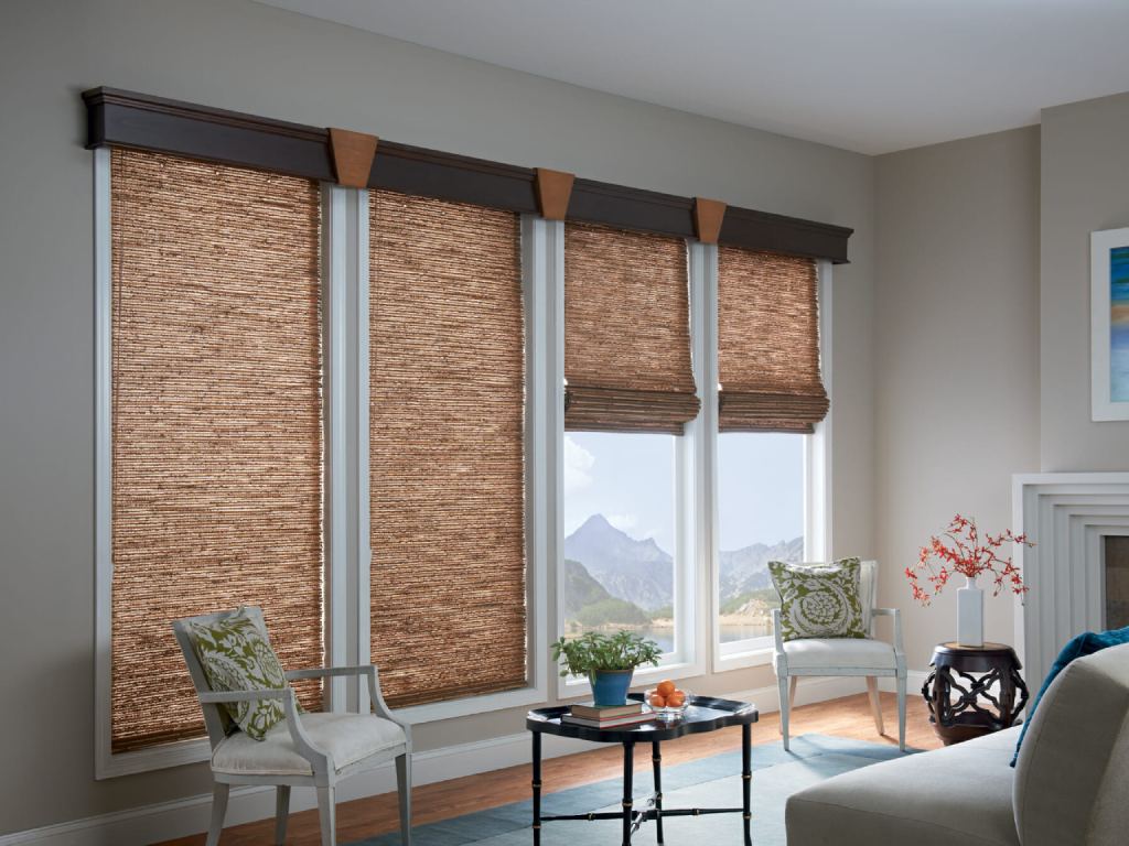 Living room with warm natural light filtering through woven wood shades.